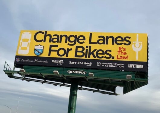BILLBOARDS UNVEILED BY OLYMPIA COMPANIES ALERT MOTORISTS TO CHANGE LANES FOR BIKES. IT’S THE LAW!